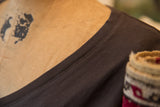 Shoulder and ribbed collar detail of the soft heathered Gunpowder V-neck t-shirt.
