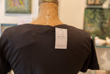 Rug Addict clothing line tag on the back collar of the Gunpowder t-shirt.