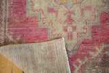 Distressed vintage Oushak runner showing hand-knotted ivory foundation and mauve patterned pile.