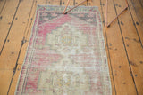 Textured pile and muted aubergine and ivory tones on this distressed Oushak runner.