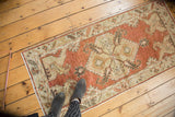 Vintage Distressed Oushak runner with faded red and beige serrated hexagonal medallion.