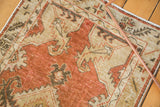 Distressed Oushak runner, showing mostly even wear, with serrated dusty red and beige motifs.