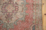 Distressed Oushak runner showing its worn knot heads and faded cinnabar, blush, gray tones.