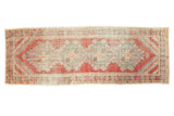 Vintage distressed Oushak runner, hand knotted, with cherry red field and seafoam medallions, 3'3
