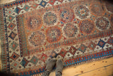 Antique Moghan Kazak runner with repeating gul motifs, Laleh Abassi border, and varied, rich tones.
