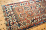 Antique Moghan Kazak runner's Laleh Abassi pawn border, geometric gul motifs in aged hues.
