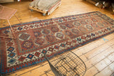 Antique Moghan Kazak runner detail with repeating geometric gul motifs and a pawn border.