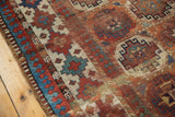 Antique Moghan Kazak runner border, `Laleh Abassi pawn motif` in time-softened reds and blues.