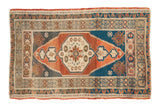 Hand knotted vintage Turkish Oushak rug, starburst medallion, stepped corners, terra cotta, navy, ivory.
