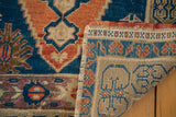 Vintage Oushak rug corner, hand-knotted texture, terracotta, blue patterns, secured edge, and reverse.