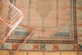 Vintage Oushak rug fringe, navy blue borders, and blush field with checker pattern.
