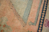 Intricate checker motif with peach, powder blue, mint, and navy wool abrashes on vintage Oushak rug.