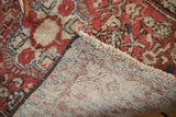 Hand-knotted foundation and fringe of the vintage Dargezine rug, with raspberry and copper pattern.
