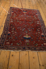 Lower border and tattered fringe of a Vintage Lilihan rug, with faded floral motifs.