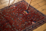 Vintage Lilihan rug: wine red field, intricate indigo, dusty rose Herati floral motifs.