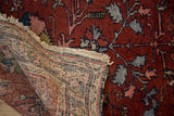 Vintage Lilihan rug's finely woven foundation, deep red floral pile, and tattered fringe.