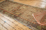 Vintage distressed Anatolian runner, with faded terra cotta and ivory rectilinear medallions.