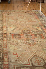 Vintage distressed Anatolian rug detail, unique woven '9' and rectilinear hook motifs in faded colors.
