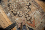 Distressed vintage Oushak rug runner showing worn pile, foundation, and soft abrash.