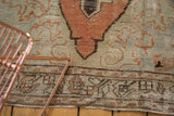 Distressed vintage Oushak runner pile revealing foundation, rust finial, sage green, and charcoal tones.