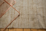 Vintage Oushak rug surface, distressed ivory and beige texture, showing foundation details.