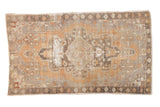 Vintage Distressed Oushak rug, oversize geometric medallion, dusty terra cotta, grey, and brown palette.