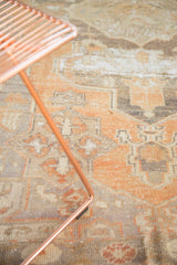 Vintage distressed Oushak rug, textured geometric patterns in terra cotta and grey.