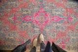 Vibrant distressed Oushak rug with bubblegum pink, fuchsia, slate blue hues and even wear.