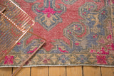 Distressed Turkish Oushak rug pattern: bubblegum pink, blue, beige, and rich texture.