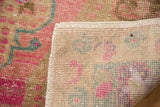Reverse view of the vintage rug showing its hand-knotted construction and intact original selvage.
