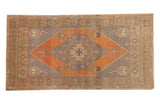 Vintage Turkish Oushak runner, burnt orange elongated medallion on oxidized silver field.