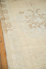 Close-up of distressed Oushak runner, showing ivory pile with subtle patterns and foundation wear.