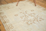 Distressed vintage Oushak texture, pale coffee brown motifs on ivory, visible foundation.