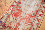Textured, distressed cherry red and ivory Oushak runner with an abstract geometric border.