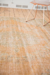 Distressed pile texture of vintage Oushak rug with apricot, pale sea foam green, and silver.
