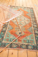 Vintage Distressed Oushak rug corner, showing tribal patterns and even wear in burnt orange, mint, and blue.