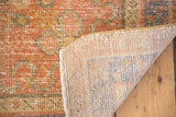 Distressed Oushak rug pile with even wear, revealing woven foundation.