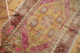 Vintage Distressed Oushak rug corner, bright pink spandrel, gold medallion, and original side cord.