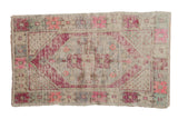 Hand-knotted vintage Oushak rug, circa 1940s, with elongated diamond medallion in faded pink, purple.