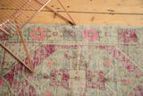 Vintage Turkish Oushak rug border, bright pink, pale blue, ivory geometric patterns, light foundation.