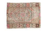 Decorative distressed Oushak rug with elongated medallion, bubblegum pink, pale blue, and ivory colors.