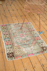 Distressed Oushak rug corner with reduced fringe and primitive geometric border.