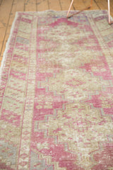Softly worn pile of a vintage distressed Oushak runner in dusty purple and ivory.