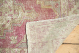 Hand-knotted foundation and original side cord selvage on a vintage distressed Turkish Oushak runner.