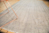 Distressed Oushak pile showcasing subtle ivory and charcoal floral pattern.