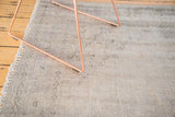 Distressed vintage Oushak carpet pile showing subtle tone-on-tone floral motifs.