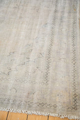 Distressed vintage Oushak pile with subtle ivory, silver, charcoal tone-on-tone patterns.