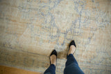 Vintage distressed Oushak carpet texture with even wear, revealing faded royal blue, ivory, beige.