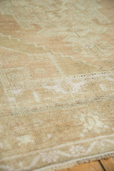 Distressed texture and short pile showing subtle curvilinear Oushak patterns in sand and ivory.