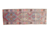 Vintage distressed Oushak rug runner, triple stepped lozenge medallions in pink, pale blue, ivory.